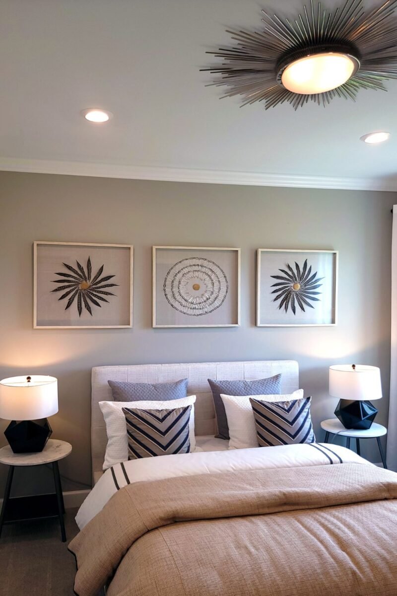 A tidy, well-organized small couples bedroom with matching lamps — the opposite of clutter creep
