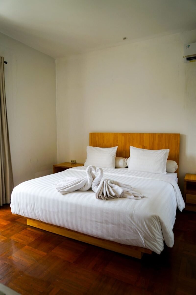 Small guest bedroom in soft, warm neutral tones