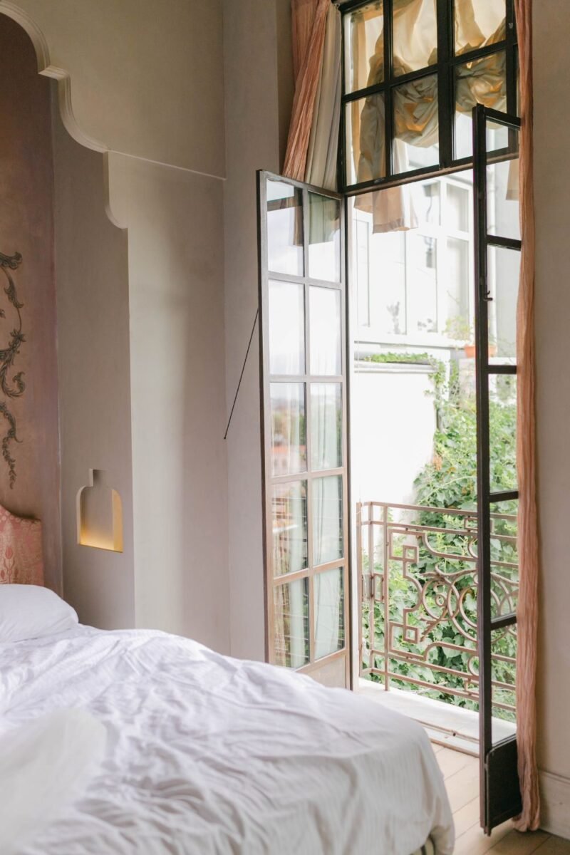 A tidy, well-organized shared bedroom with matching lamps — the opposite of clutter creep