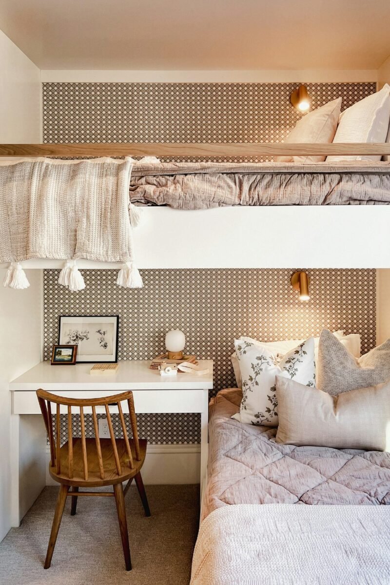 Loft bed in a small teen bedroom with a study desk tucked underneath